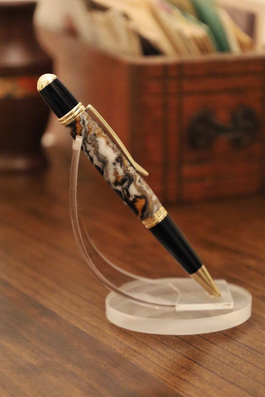 Decorative pen on a stand with a blurred background