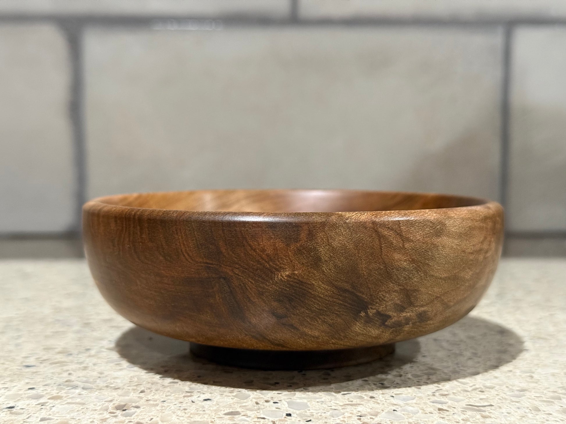 Wooden bowl on a kitchen counter